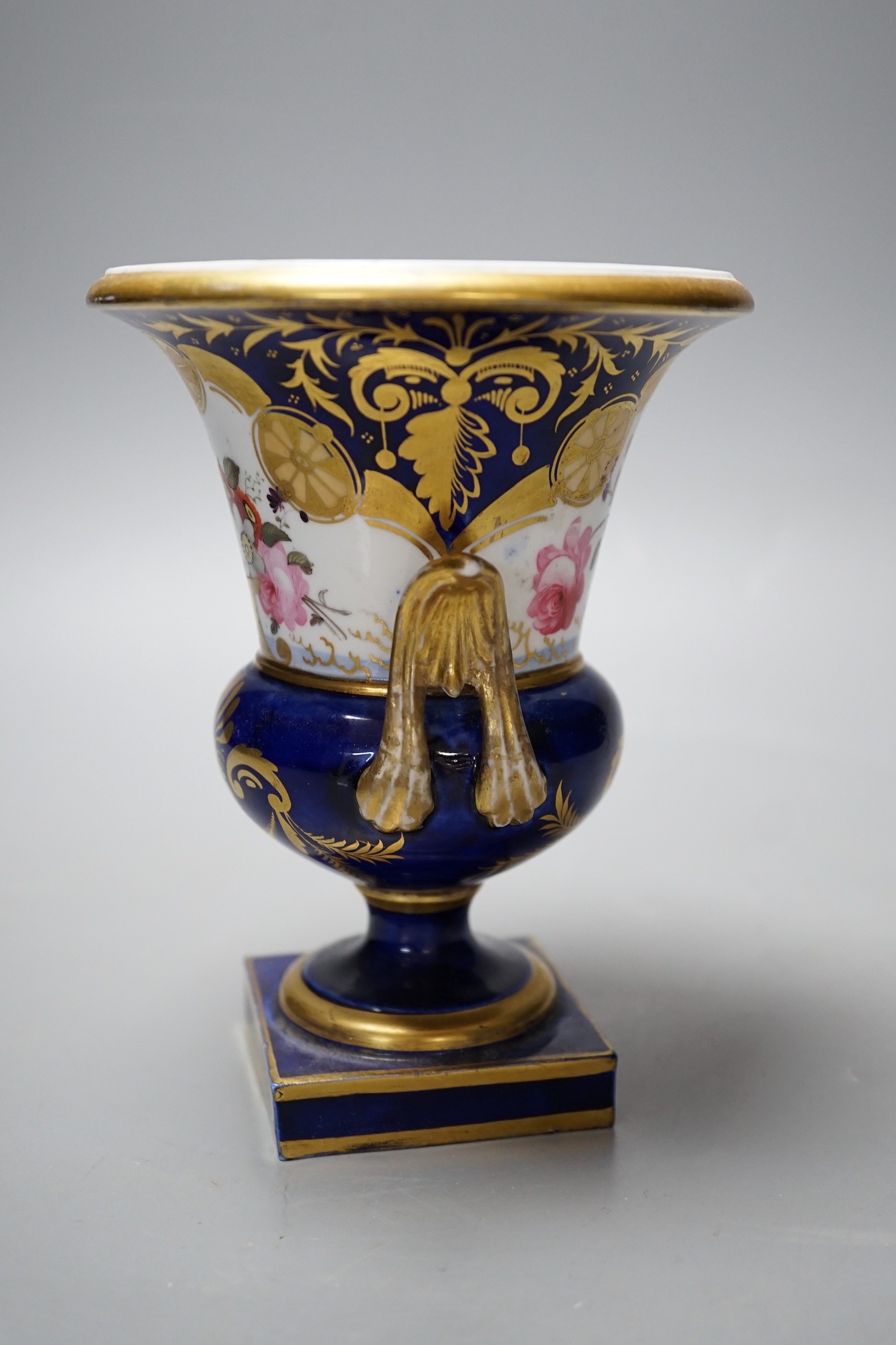 A Paris porcelain two-handled vase urn, with floral decoration, 16cm tall